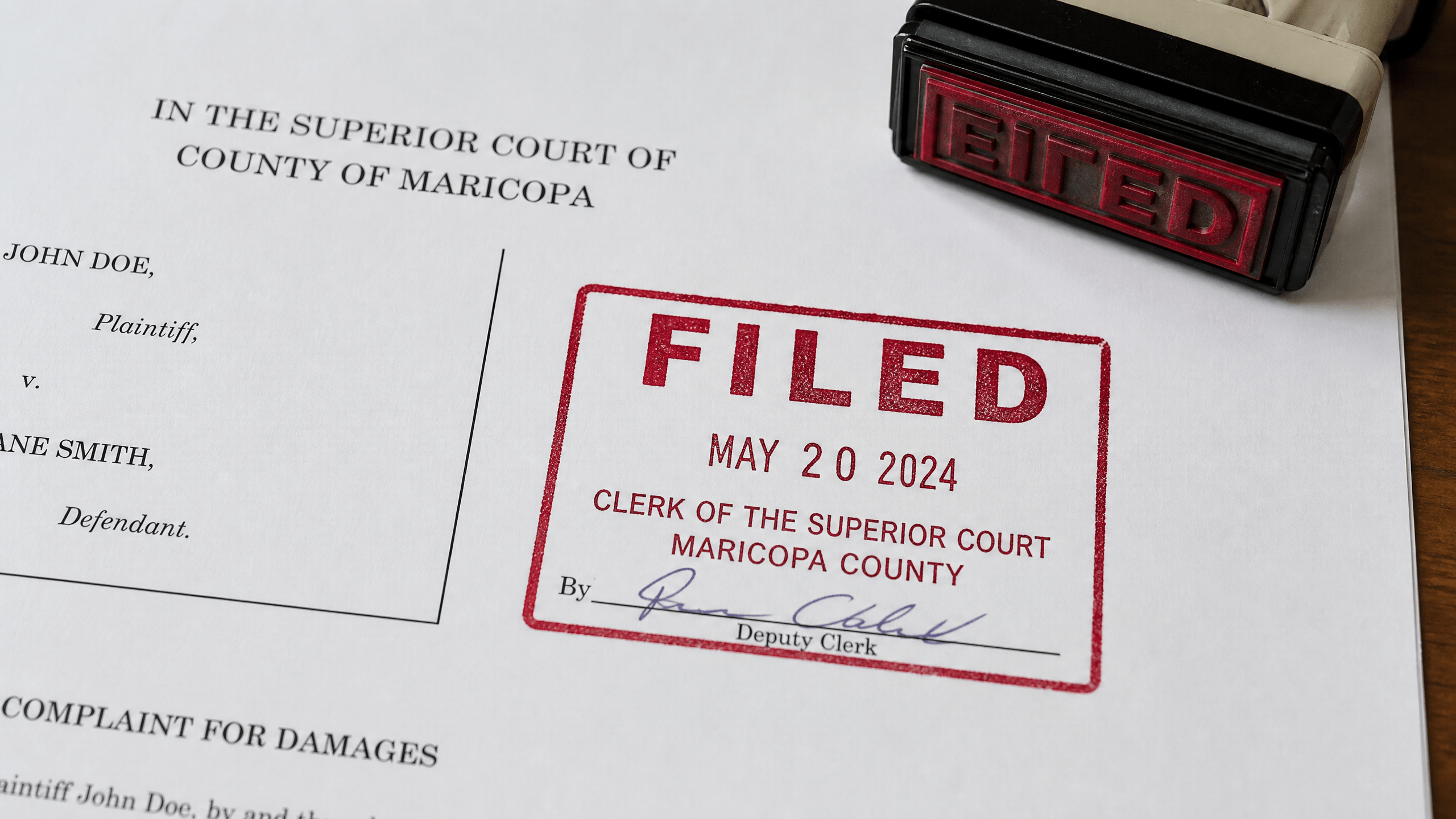 A court clerk's stamp on a document, symbolizing the importance of accurate labels in public records.